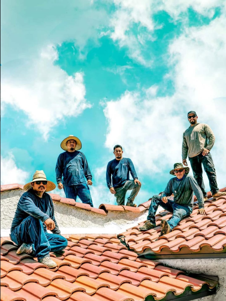 Daniel Martinez and his roofing crew on a clay tile roof in Southern California