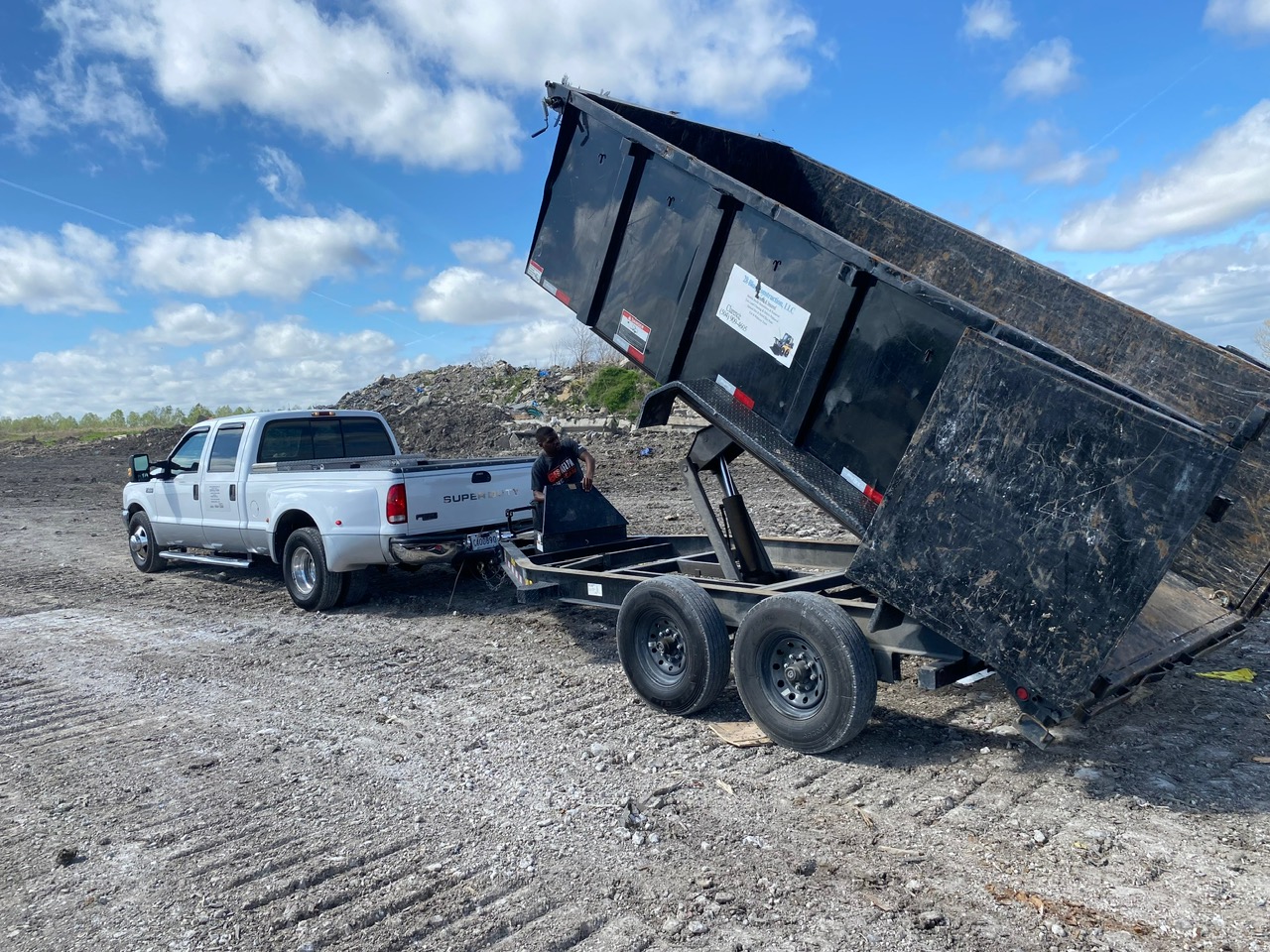 28 Blue Construction dump truck and trailer ready for debris hauling