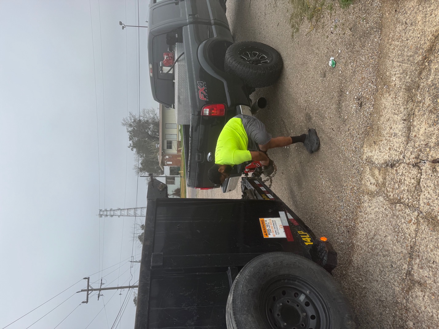 28 Blue Construction crew member preparing equipment for a demolition project