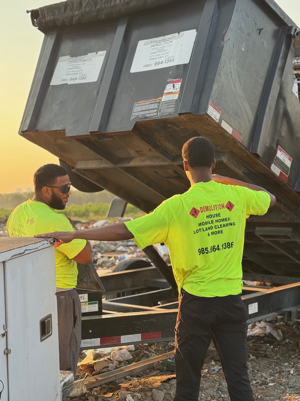 28 Blue Construction demolition crew at golden hour with branded safety gear