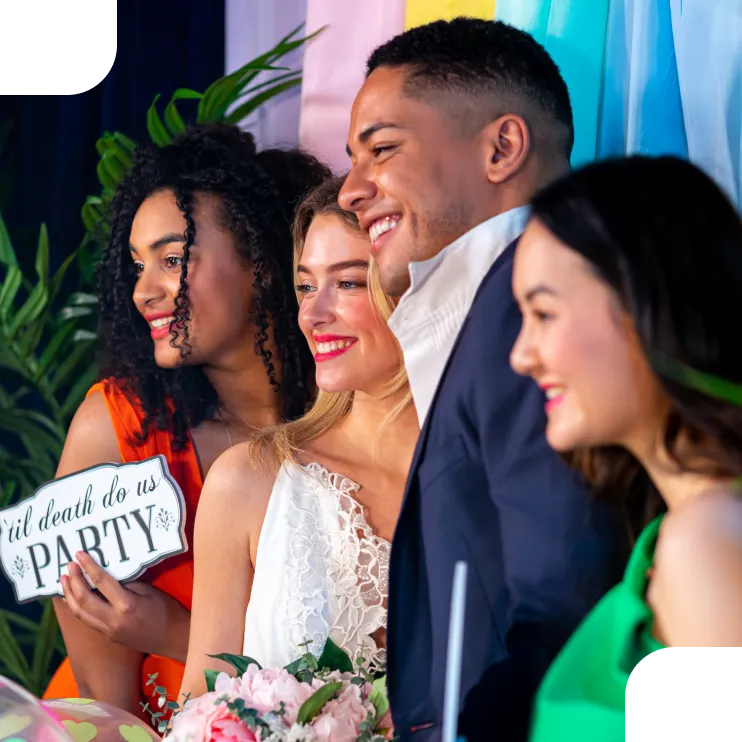 Wedding guests smiling at photo booth