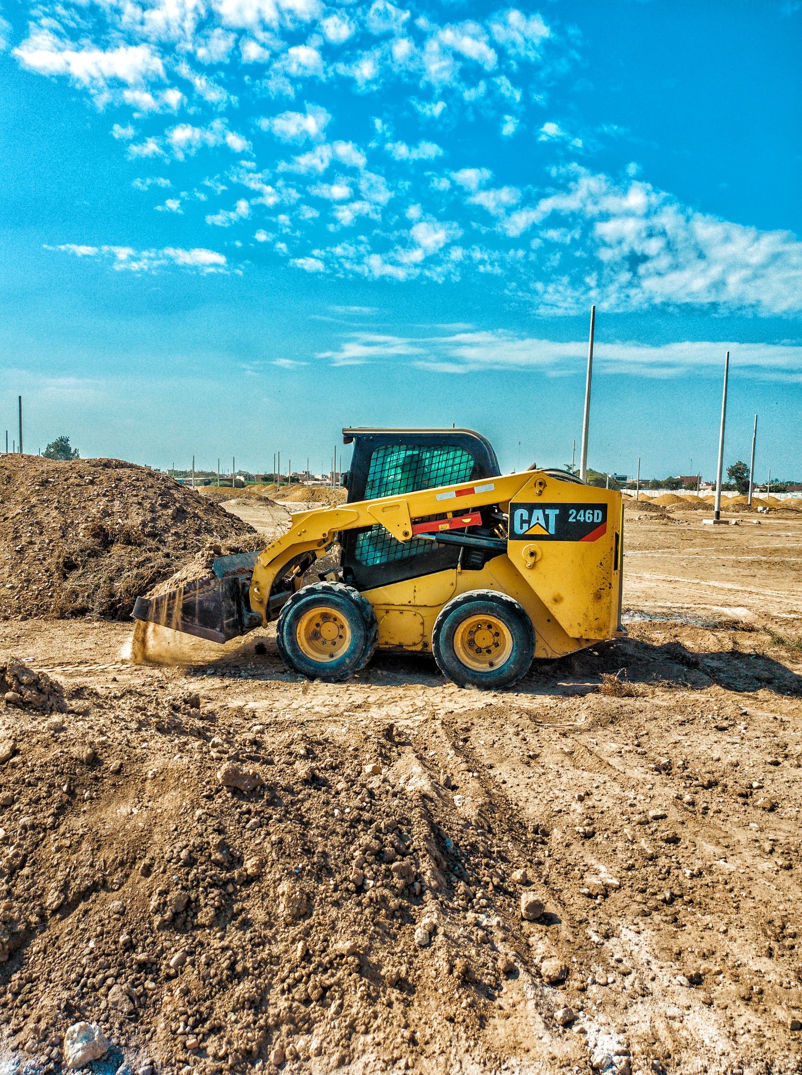 Skid steer loader working on a construction job site — skid steer and track loader financing