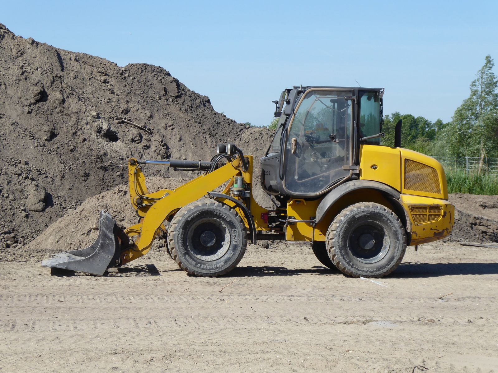 Used heavy equipment on a lot — used and private party heavy equipment financing