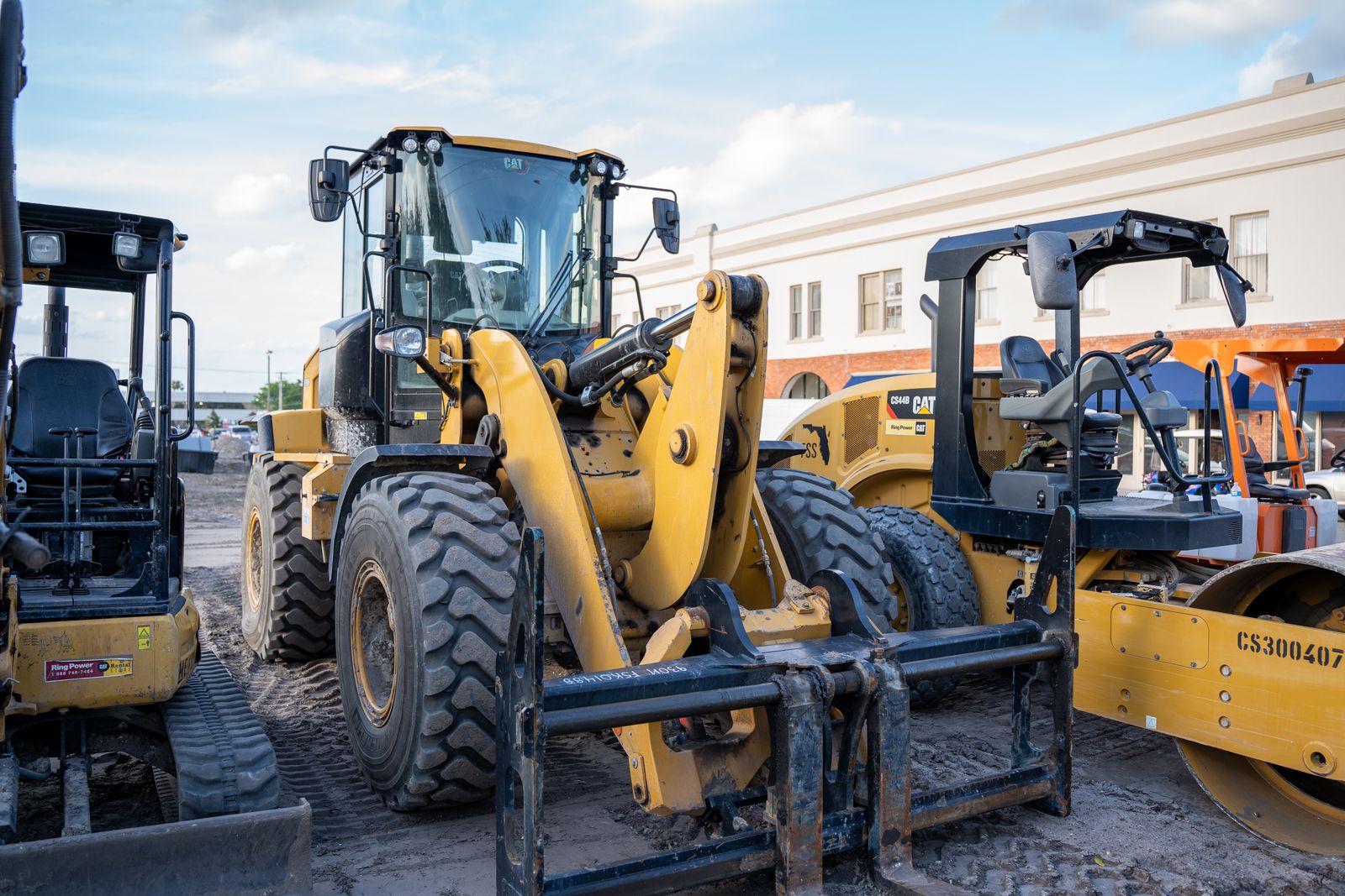 Heavy construction equipment parked at a job site — Section 179 deduction on construction equipment