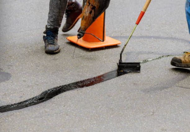 Hot Asphalt Crack Filling โ Always Sealcoating & Paving