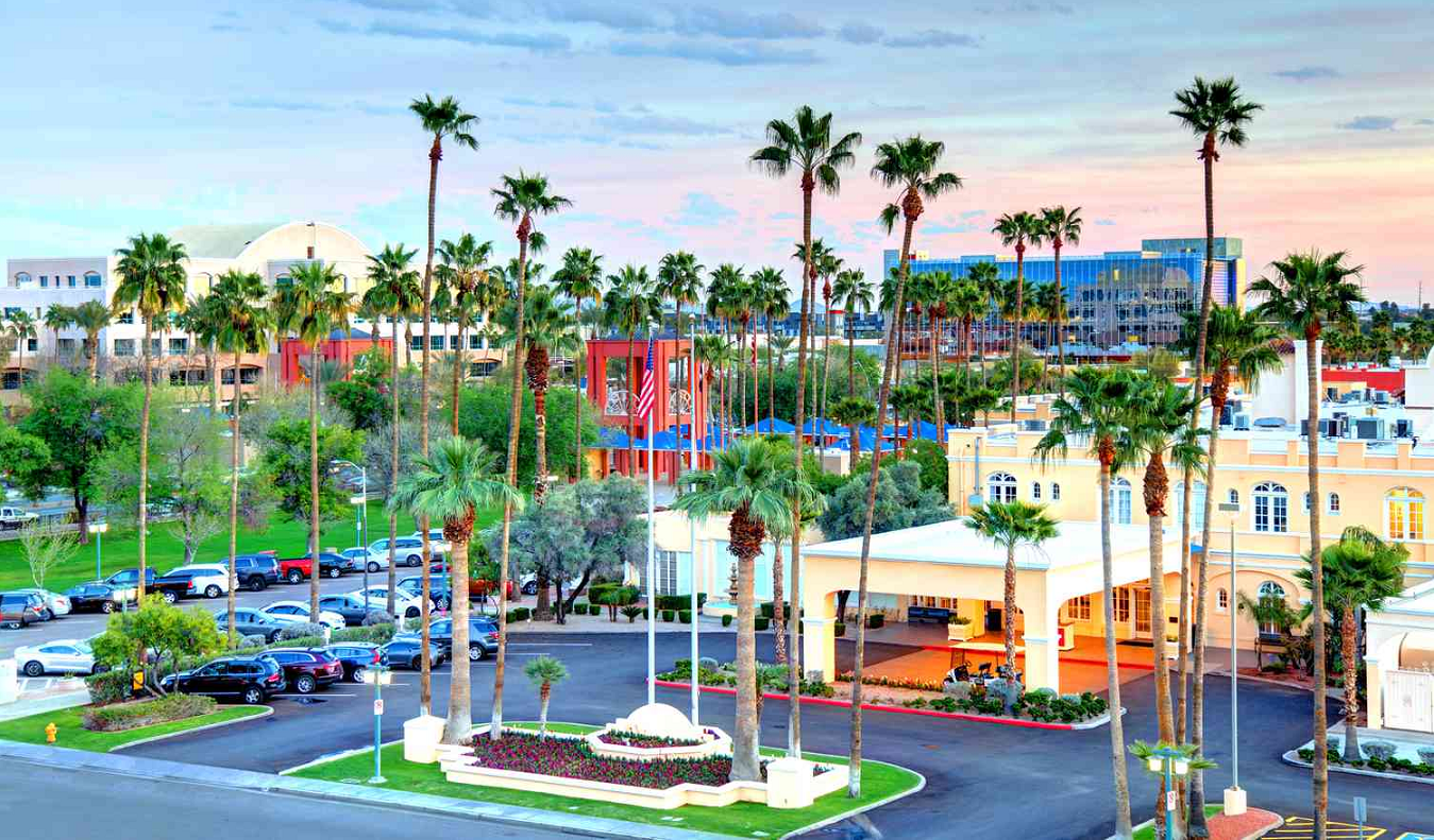 Downtown Chandler Arizona at sunset with palm trees, modern buildings, and warm evening atmosphere