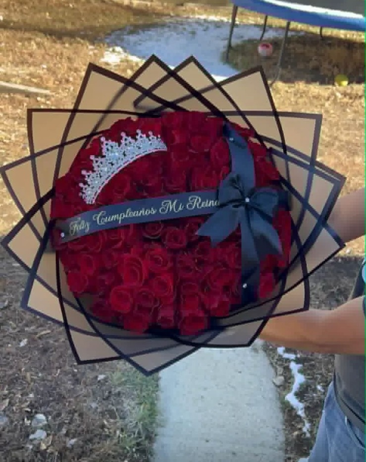 Stunning 'Feliz Cumpleaños Mi Reina!' 100-rose deep red Ecuadorian round rose bouquet with sparkling crystal crown tiara, 'Feliz Cumpleaños Mi Reina!' silver script black satin ribbon bow, sleek black geometric paper wrap - luxury birthday queen celebration arrangement by FridAndre Florals