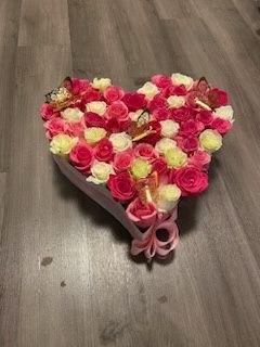 Elegant heart-shaped gift box filled with pink, white, and cream Ecuadorian roses, golden laser-cut butterfly decorations, soft pink satin ribbon bow - medium size romantic arrangement