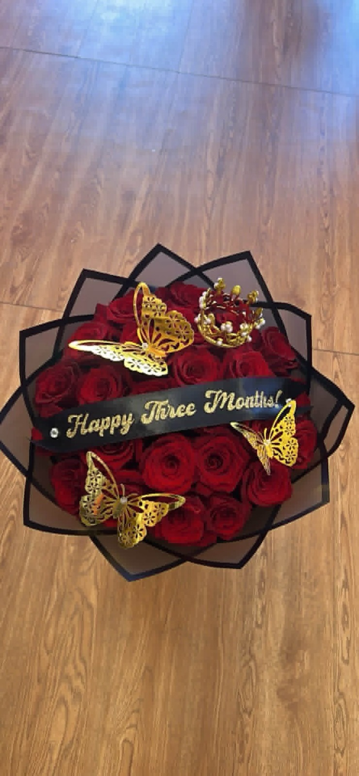 Romantic 'Happy Three Months!' 25-rose red Ecuadorian rose bouquet with golden jeweled crown tiara, golden laser-cut butterfly decorations, 'Happy Three Months!' gold-glitter lettered satin ribbon bow, sleek black geometric paper wrap - anniversary celebration arrangement