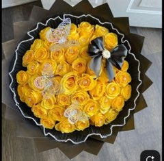 Luxury yellow Ecuadorian rose bouquet adorned with crystal butterflies, black satin bow with pearl brooch centerpiece, and black scalloped trim wrap by FridAndre Florals