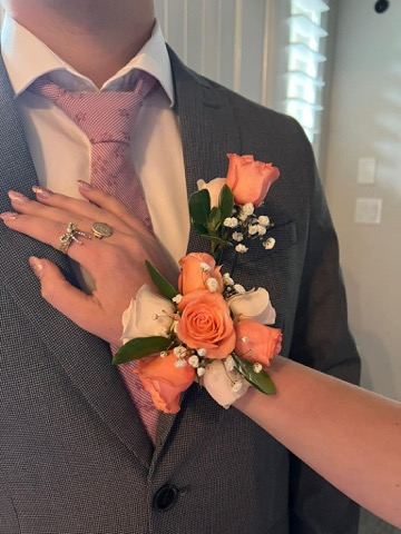 Elegant peach rose corsage for formal events