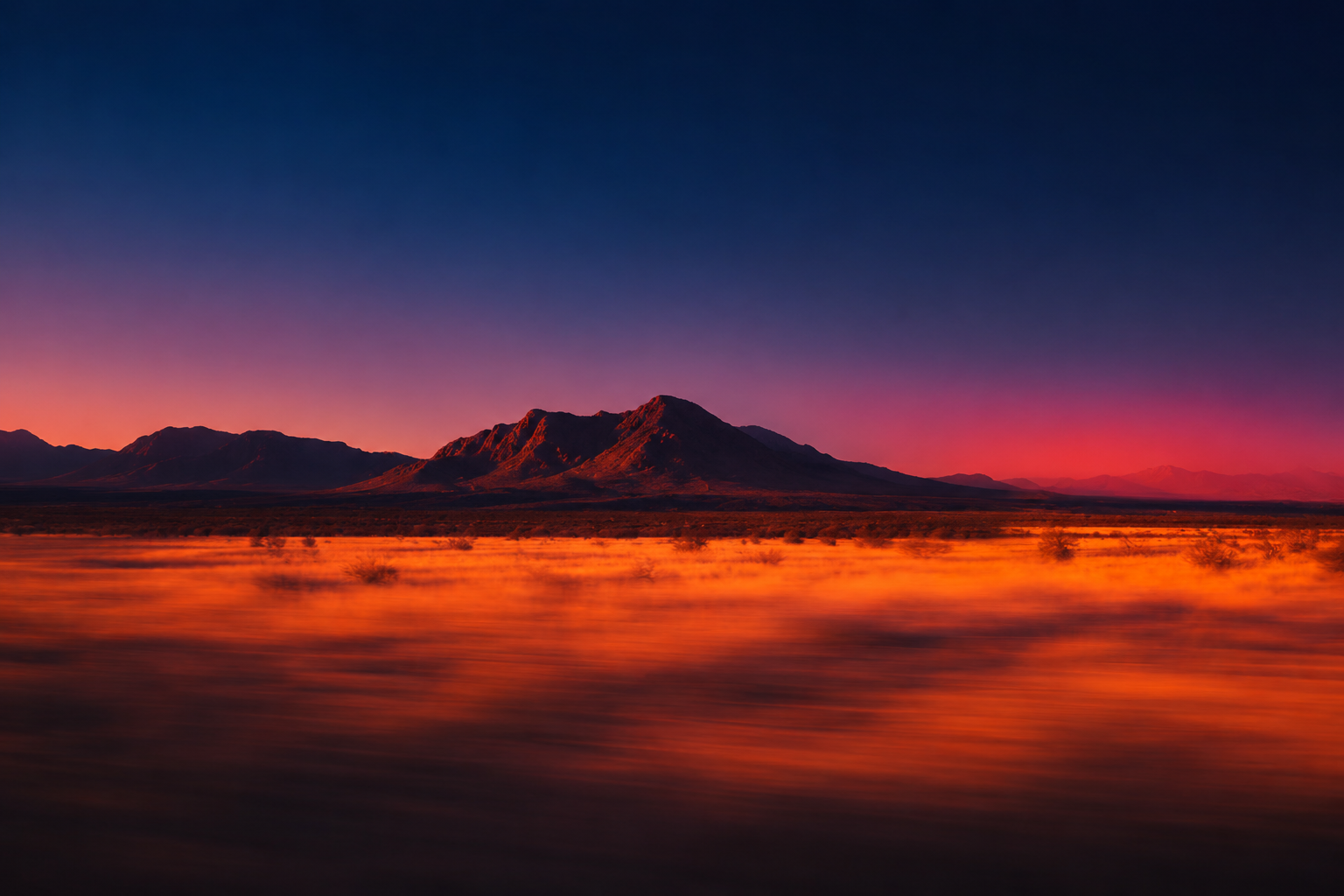 Desert sunset landscape with mountains