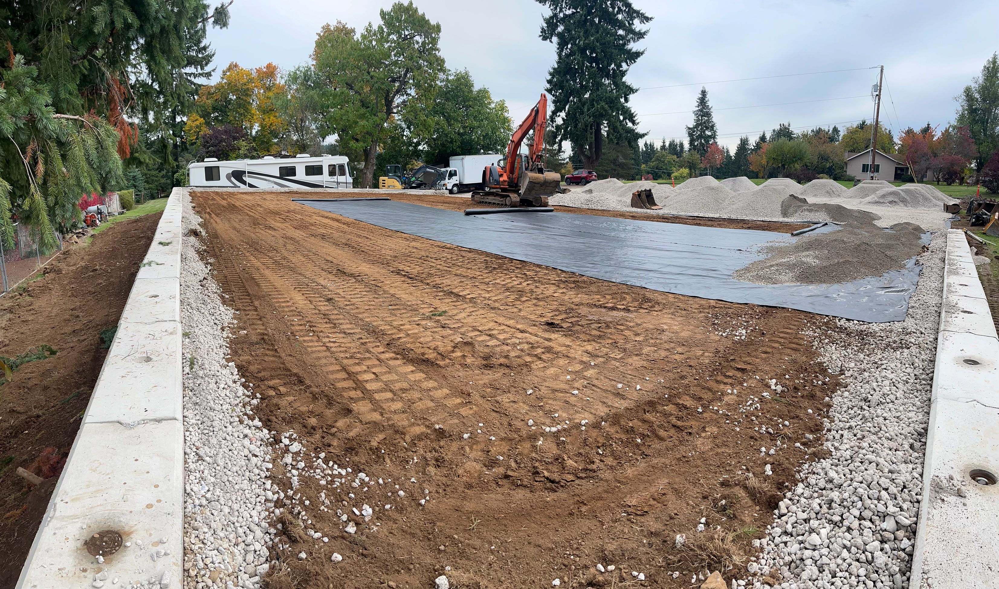 Excavation — Acreage building pad excavation with geotextile fabric & block wall — representative project image