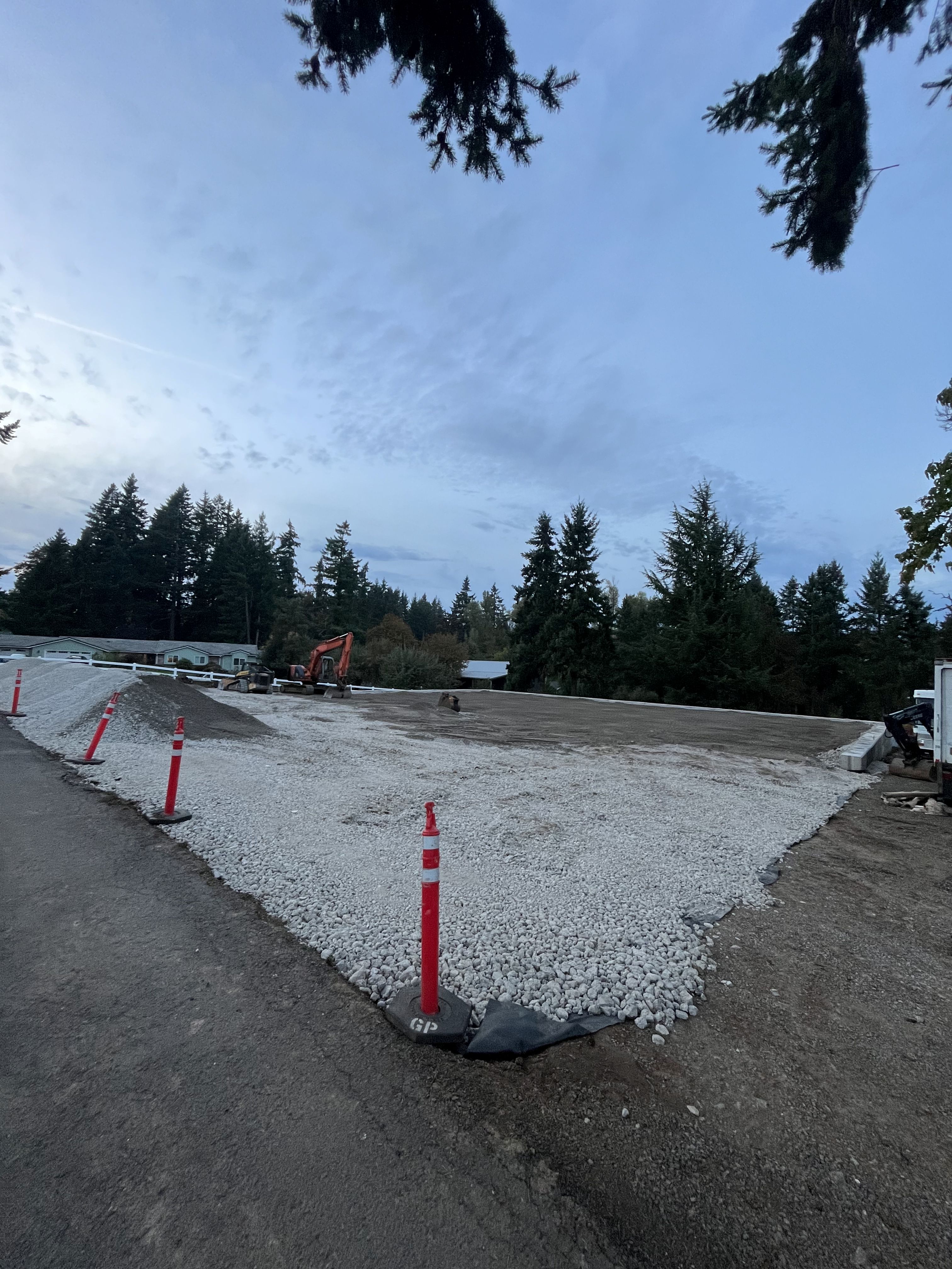 Excavation — Graded & compacted gravel access pad with safety perimeter — representative project image