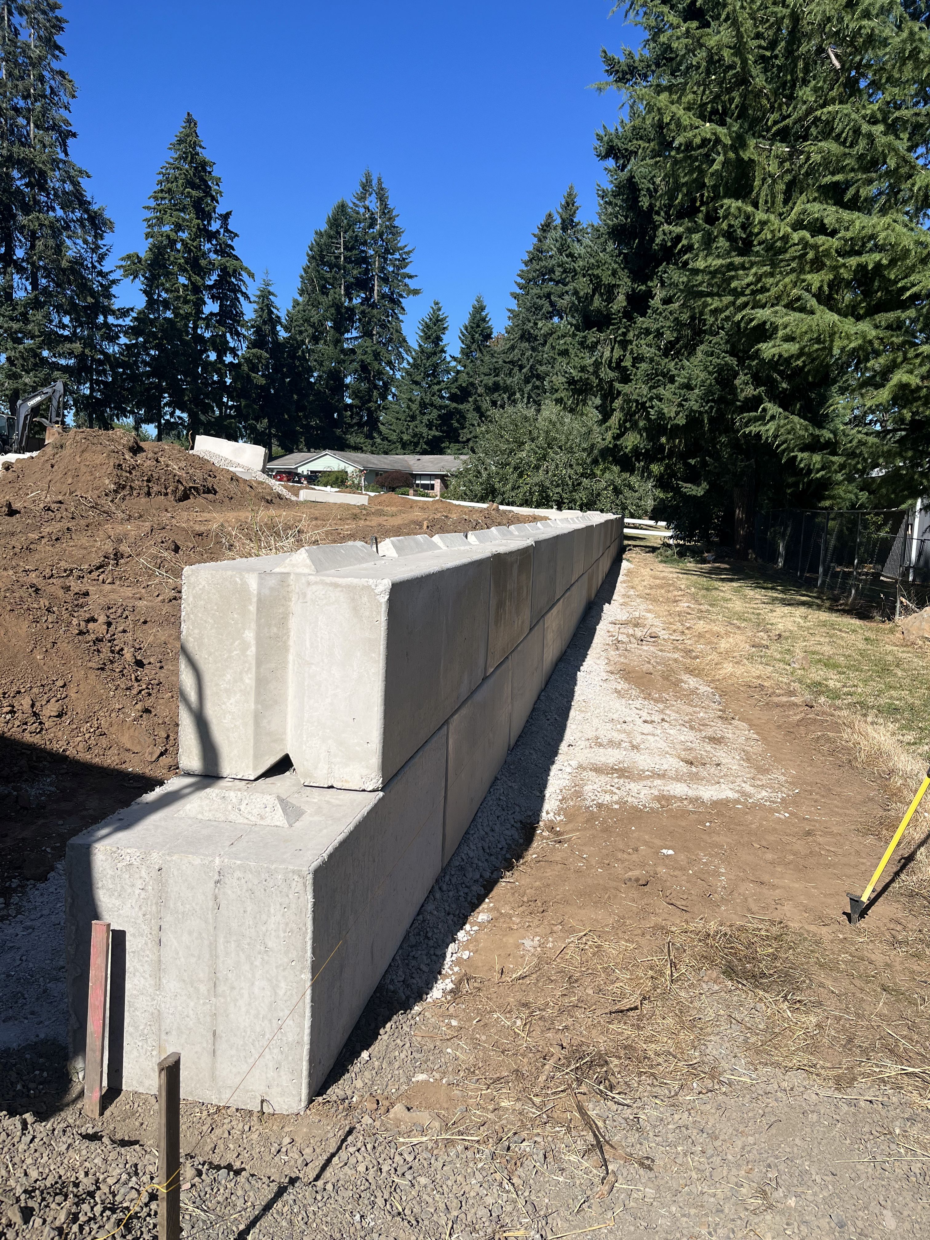 Excavation — Retaining wall excavation & block base alignment — representative project image