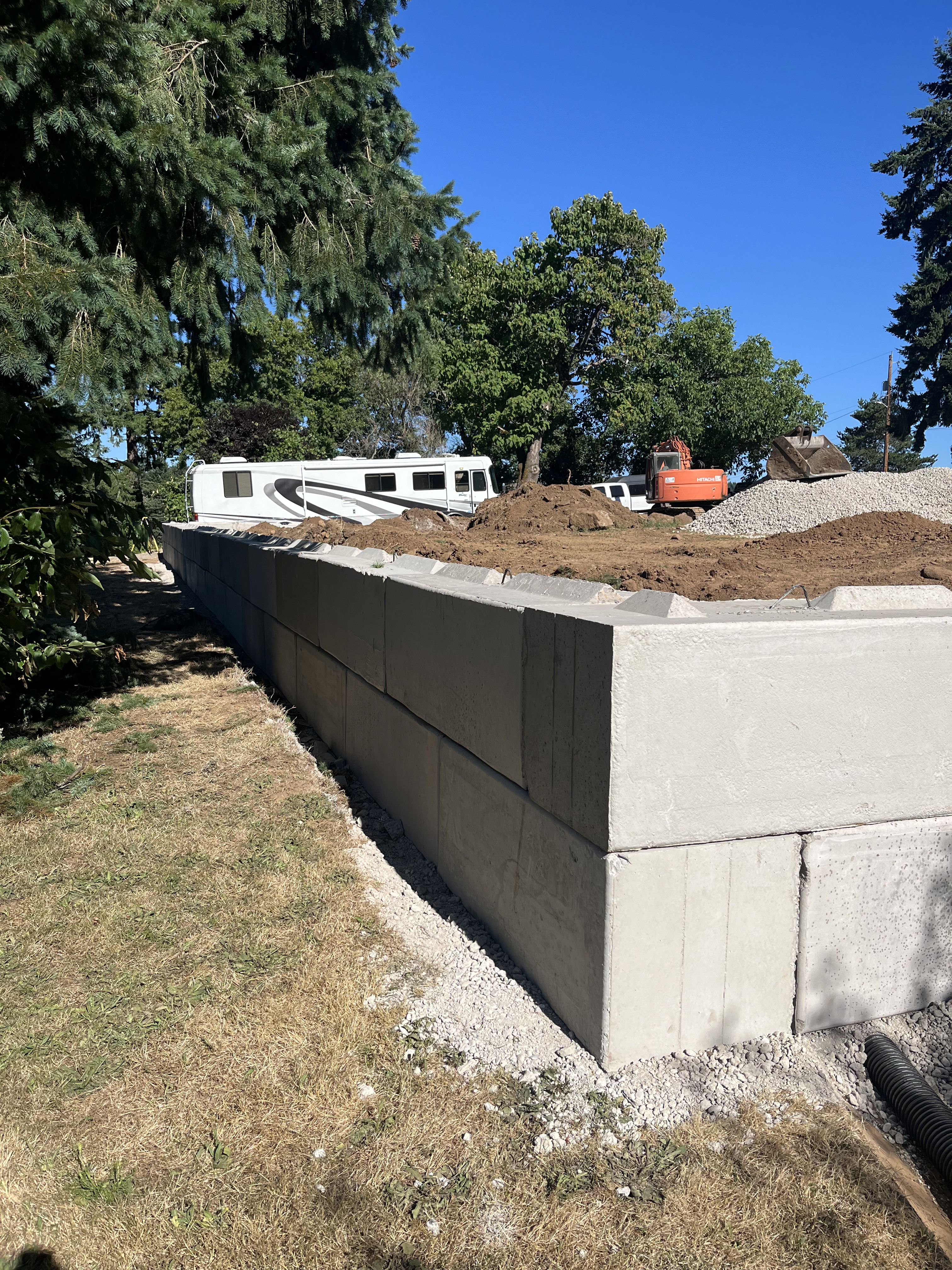 Excavation — Heavy block retaining wall backfill & subgrade stabilization — representative project image