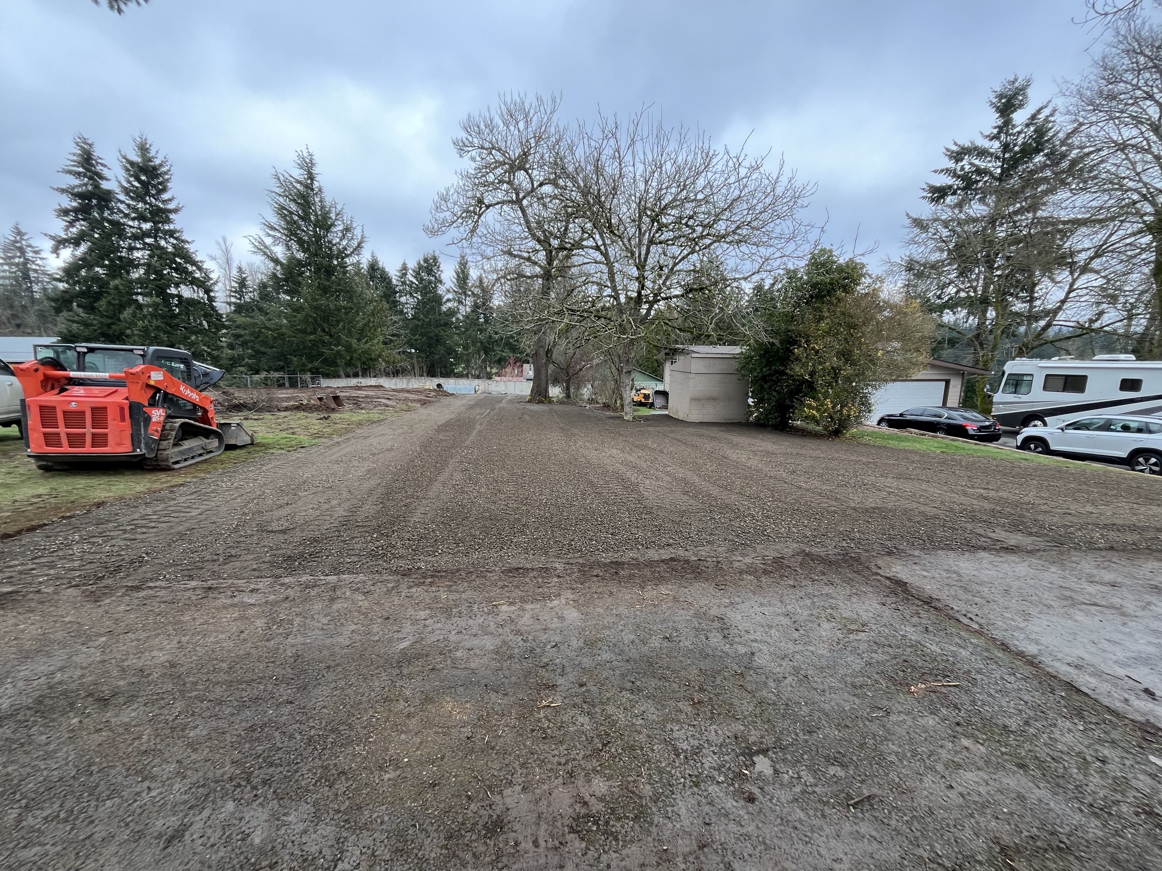 Excavation — Kubota SVL precision grading & gravel pad finish — representative project image