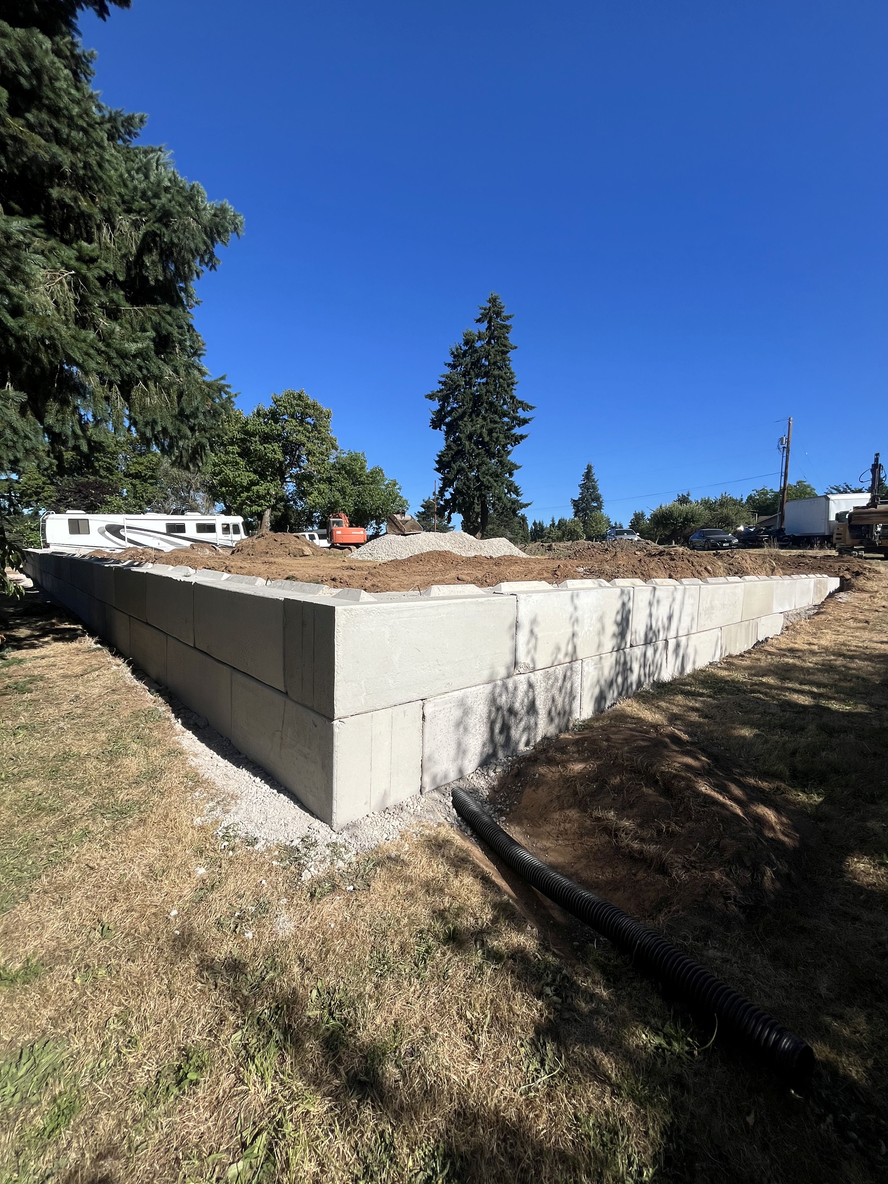 Excavation — Structural ecology block retaining wall corner & drainage prep — representative project image