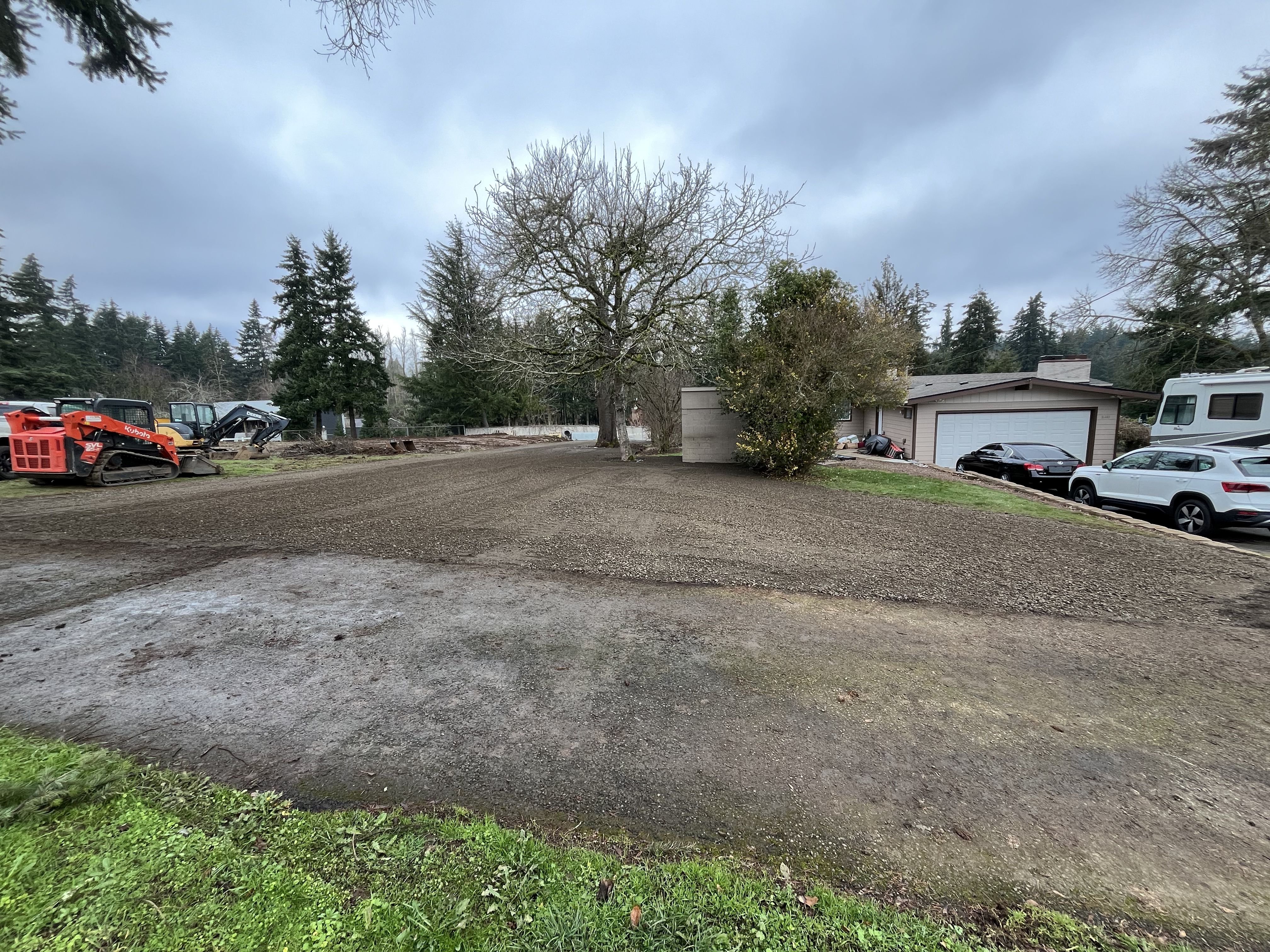 Excavation — Acreage excavation & completed gravel parking pad — representative project image