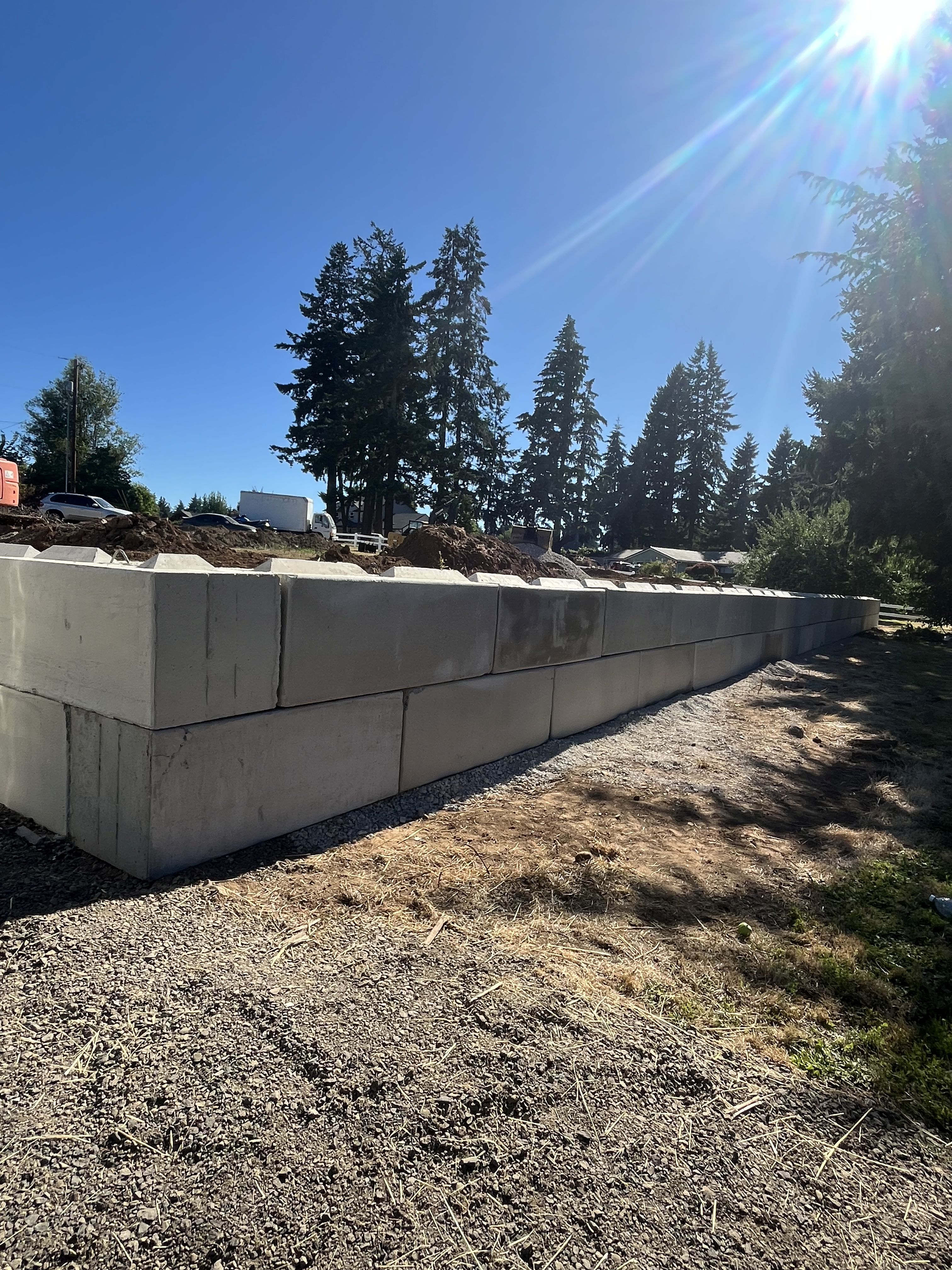 Excavation — Heavy concrete ecology block retaining wall installation — representative project image