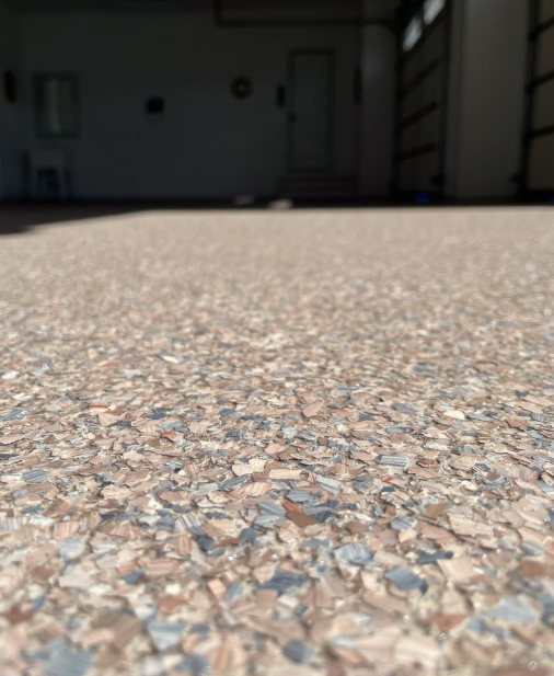 Finished polyaspartic flake garage floor in gray-silver blend