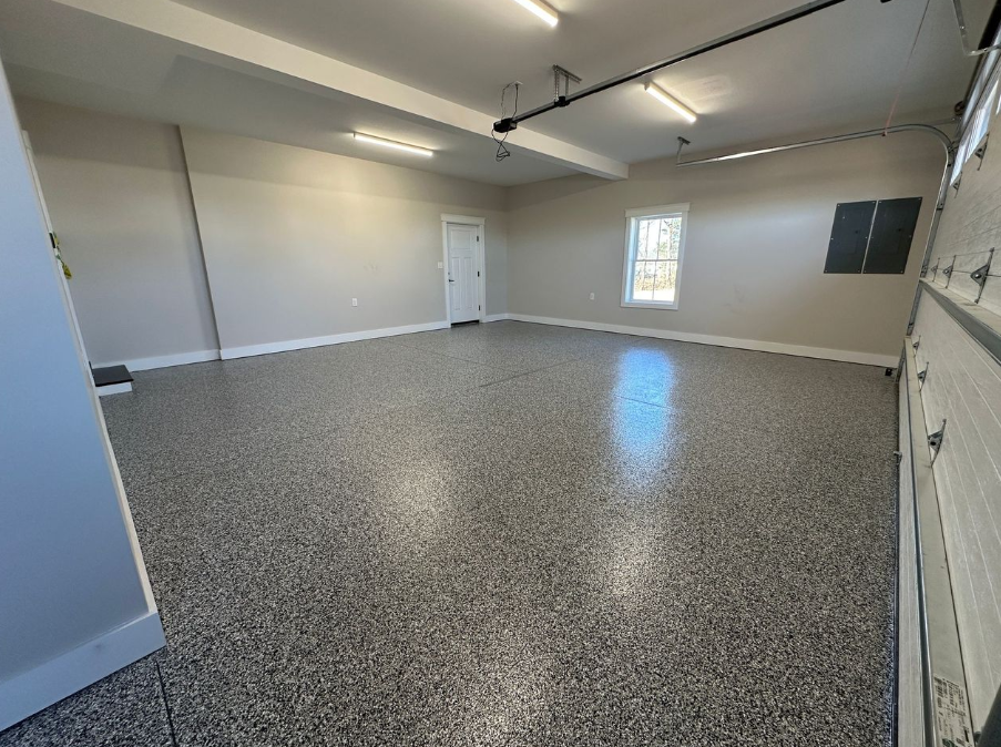 Finished polyaspartic flake epoxy garage floor by Resin Quarry Customs
