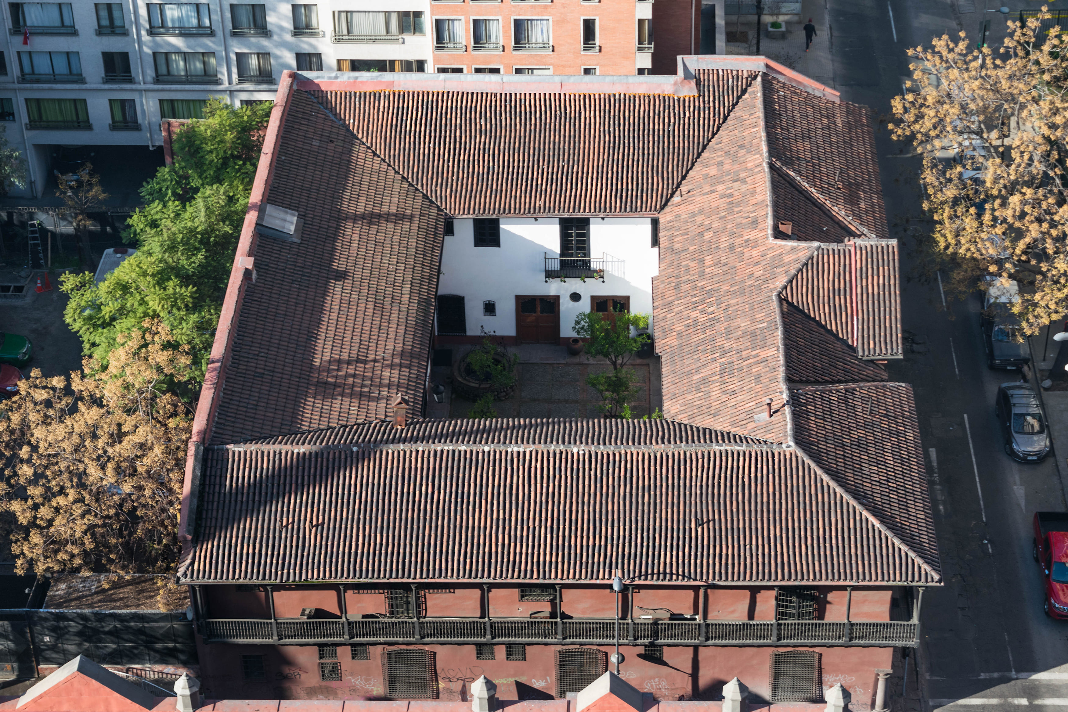 Aerial view of period tiled roof with courtyard