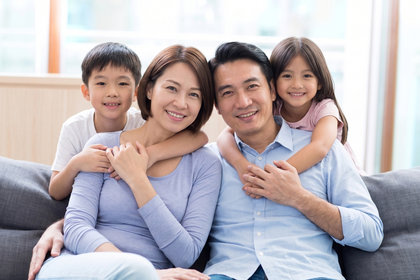 Happy family smiling together - representing clear vision and quality of life with Ortho-K treatment