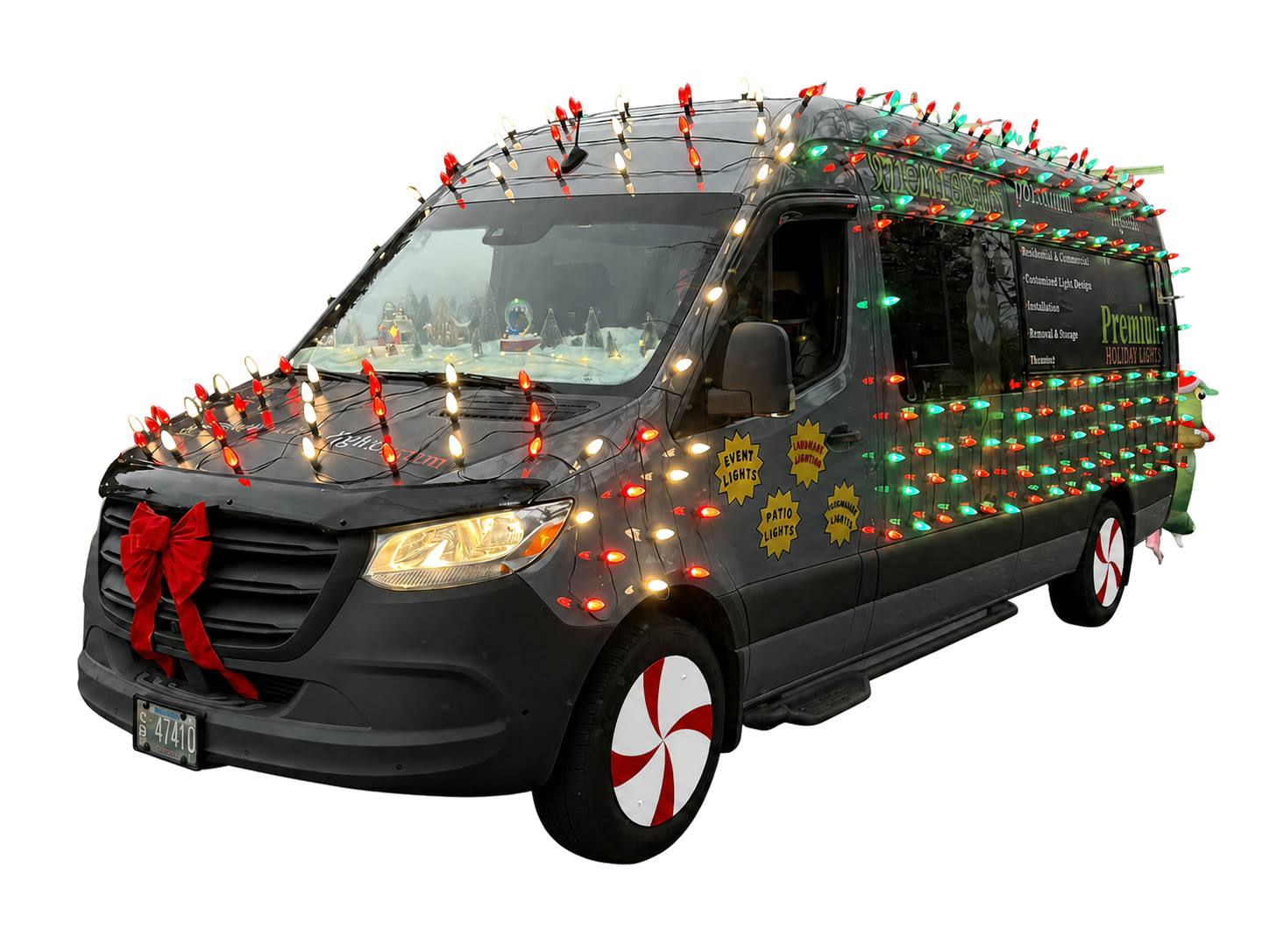 Premium Holiday Lights branded company van decorated with holiday lights, parked in Salem, Oregon