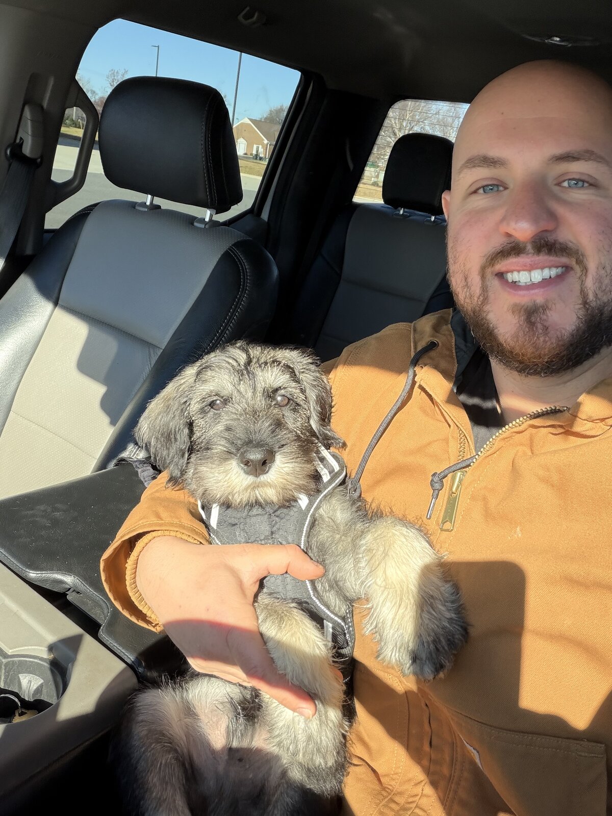 John L, co-owner of Triad Land WorX, with his dog