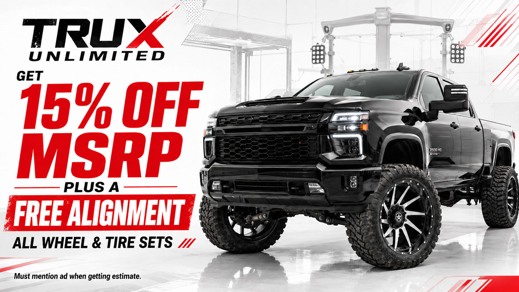 Modern lifted pickup truck with aggressive off-road wheels and tires — 15% Off MSRP plus free alignment