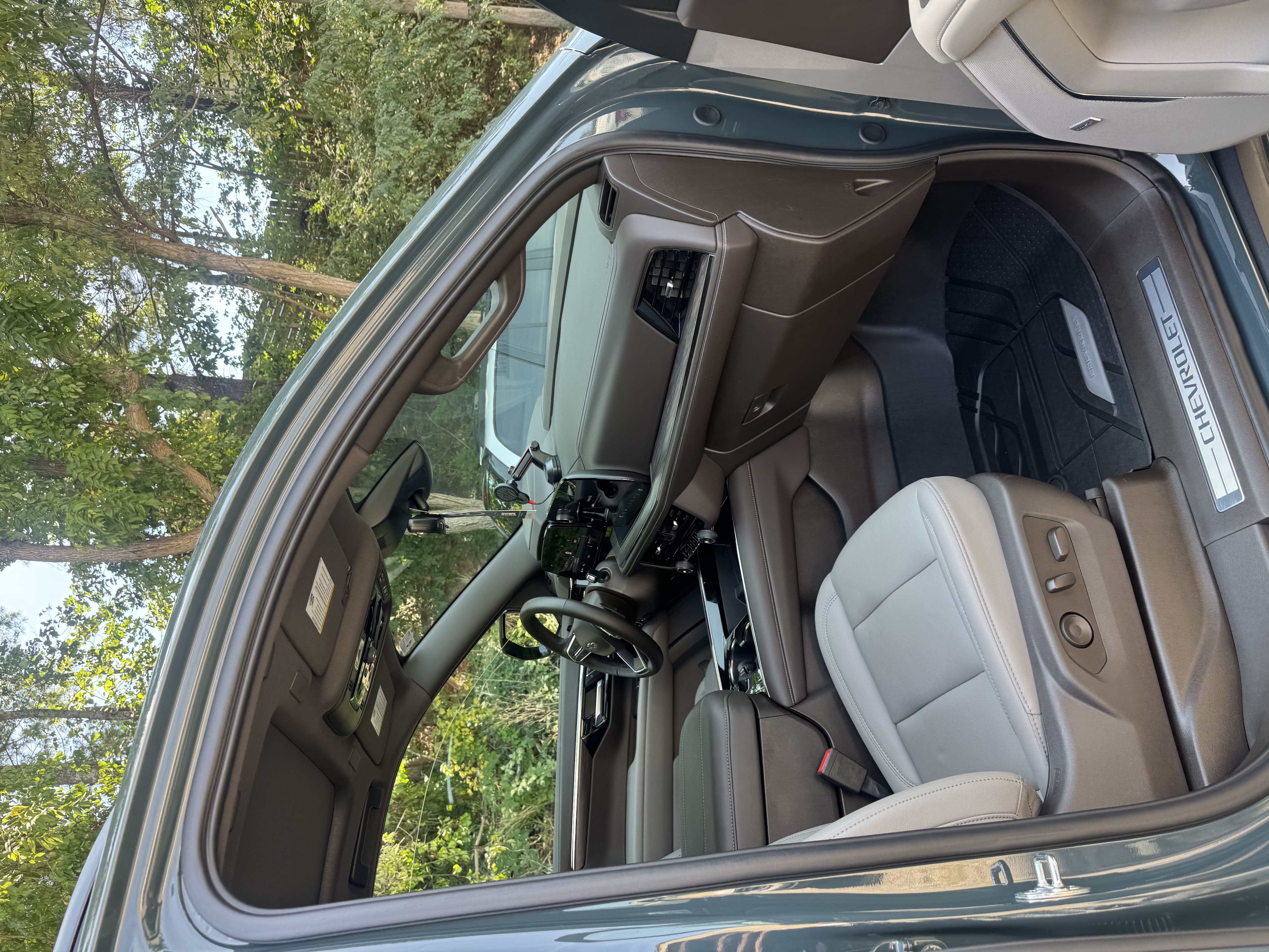 Chevrolet truck interior with clean leather seats and dashboard after professional interior detailing
