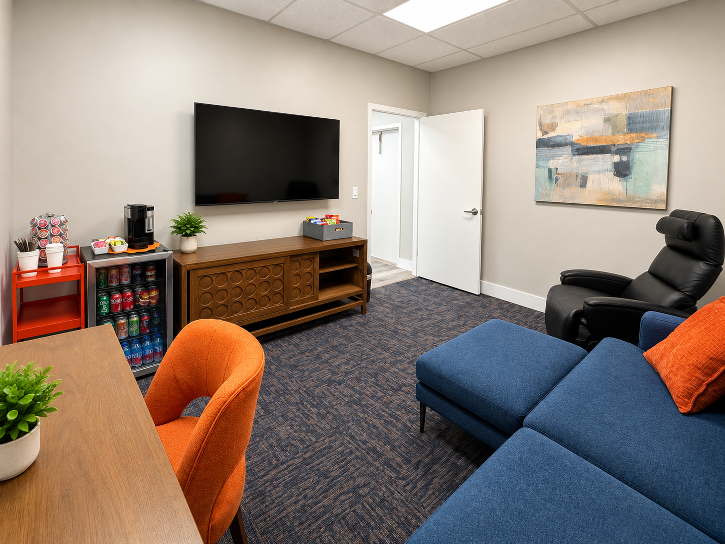 Executive Blue Lounge Suite with sectional, power recliner, refrigerator, and 4K TV