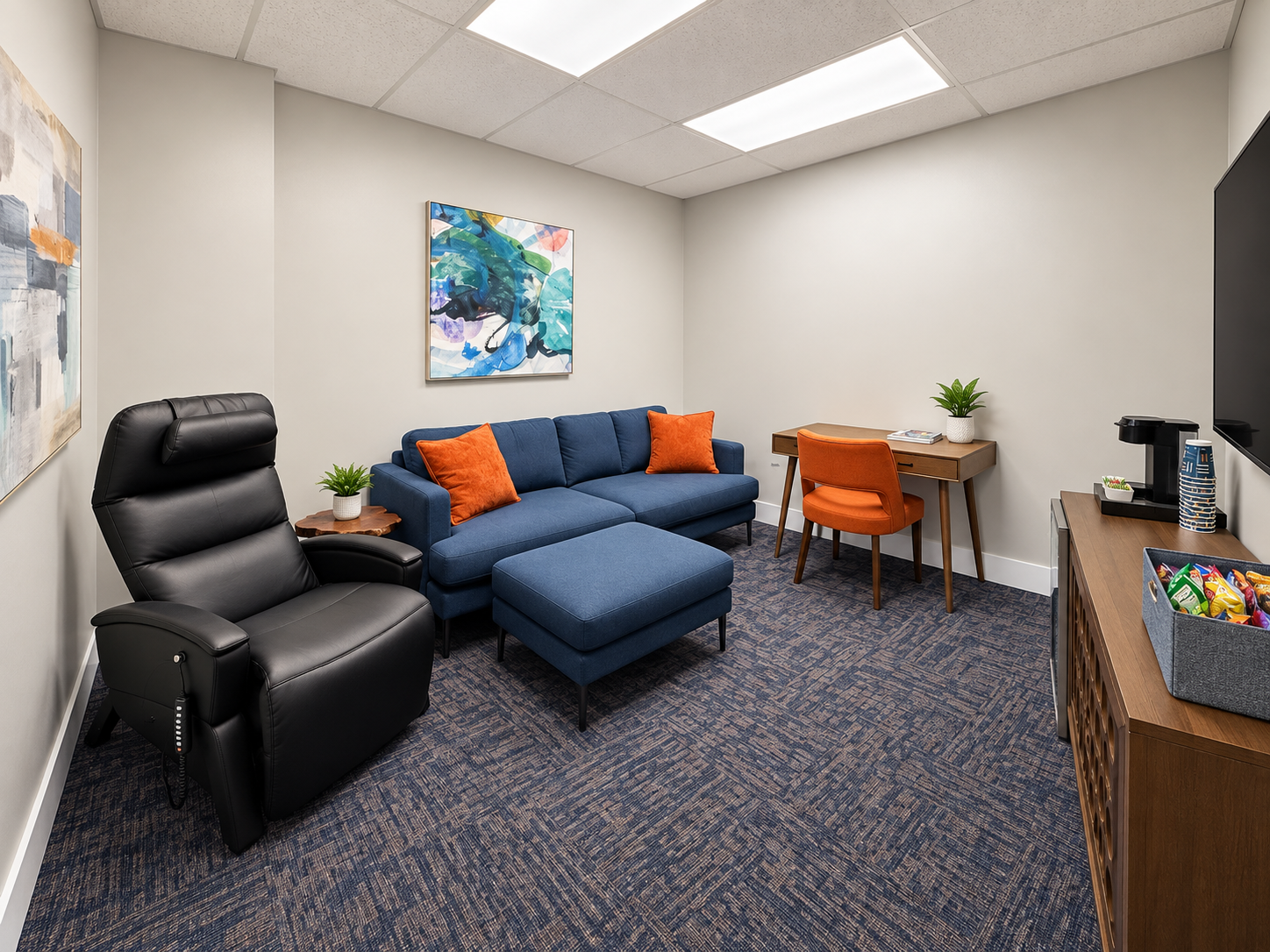Quiet private suite with desk, power leather recliner, and blue sectional for patient rest during 5-day SAINT week