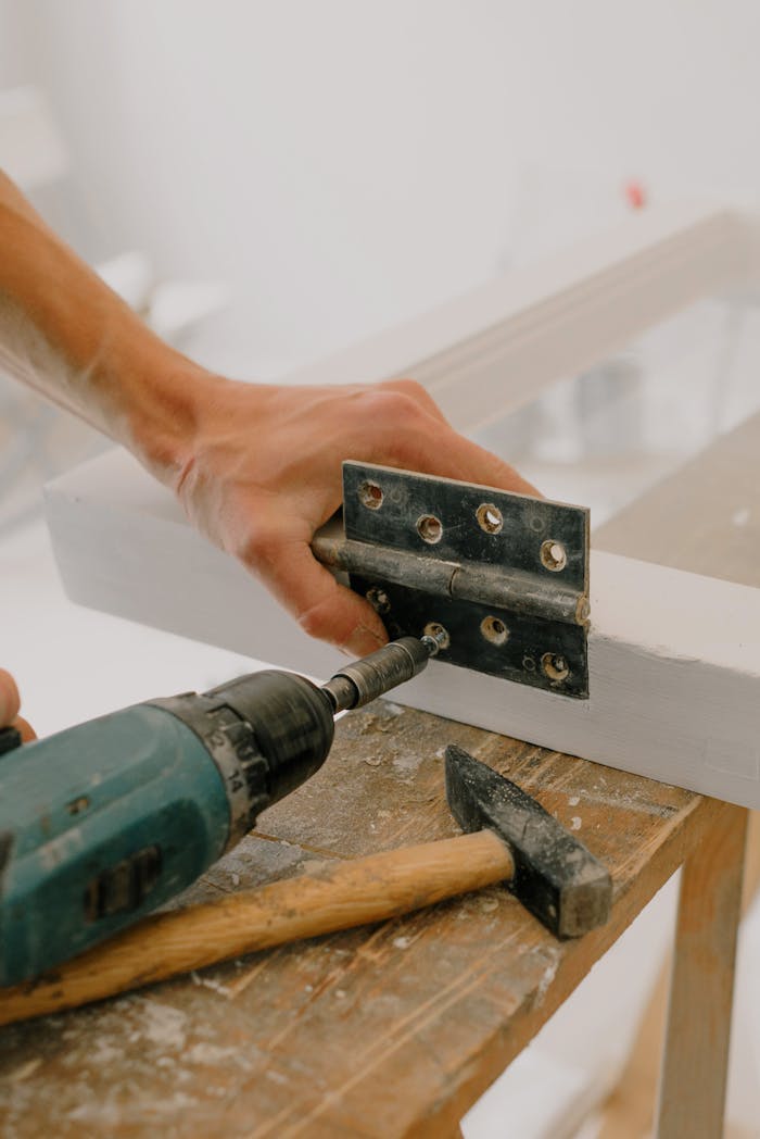 Handyman fastening metal window hinge