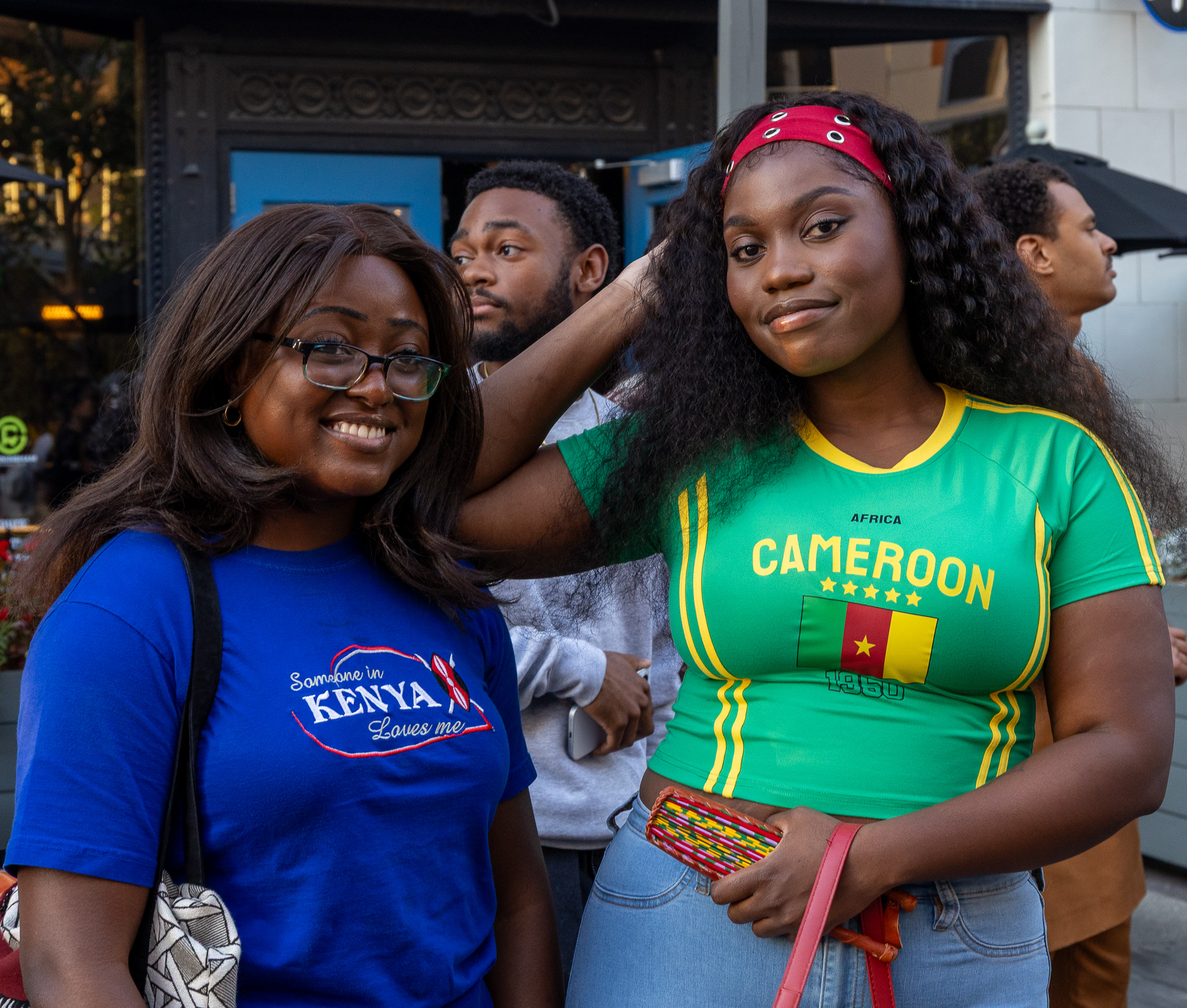 Attendees smiling together representing Kenya and Cameroon at Taste of Africa