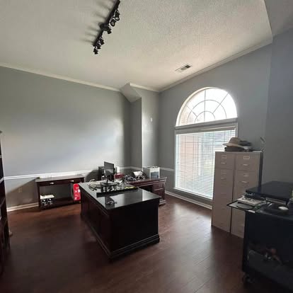 Commercial office suite with custom arched window casing and chair rail trim