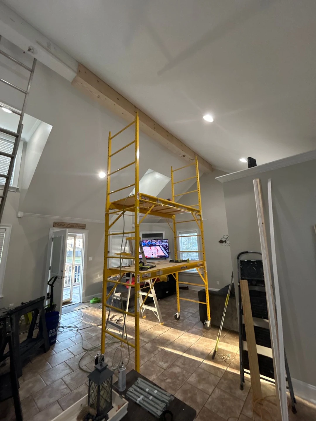 High-ceiling structural wood beam casing and crown installation
