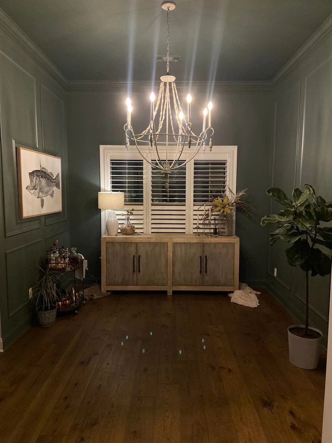 Designer dining lounge with finished decorative wainscot paneling and crown trim