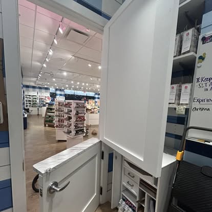 Custom commercial retail Dutch door installation with shelf trim