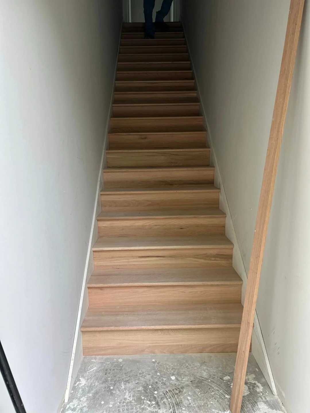 Custom hardwood stair treads and precision riser finish carpentry
