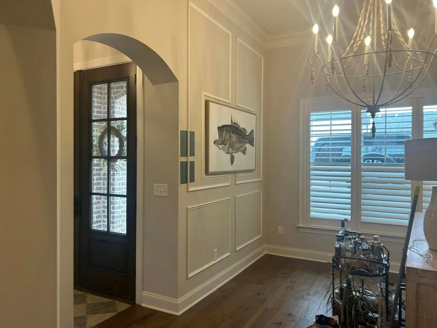 Foyer picture frame wall molding and arched opening finish trim carpentry