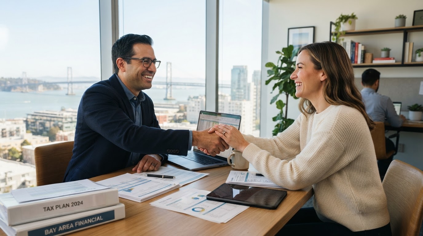 Tax advisor shaking hands with a client after finalizing a tax plan
