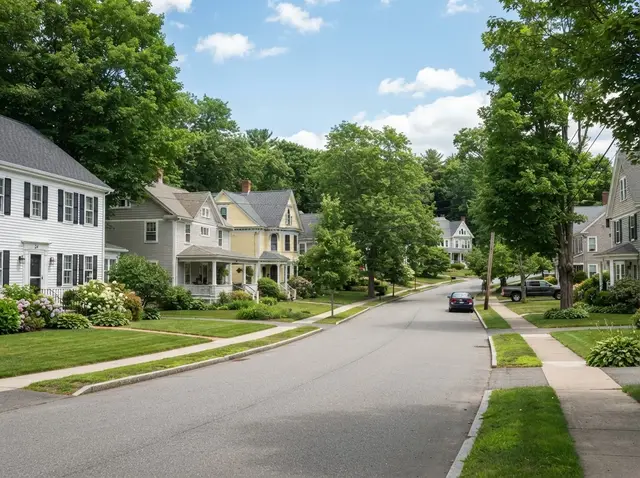 Clean Central Massachusetts residential neighborhood with suburban yards and trees