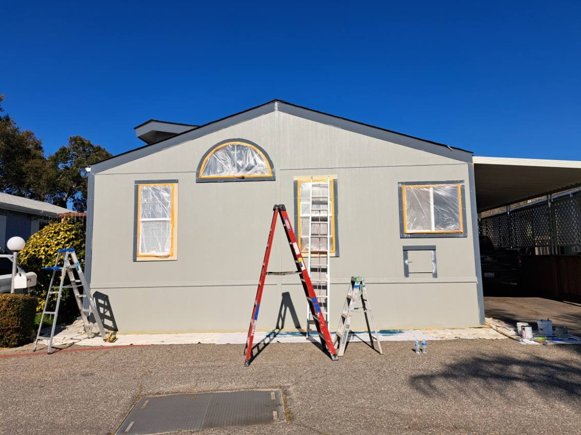 Exterior house preparation work by Rainbow Painting Inc.
