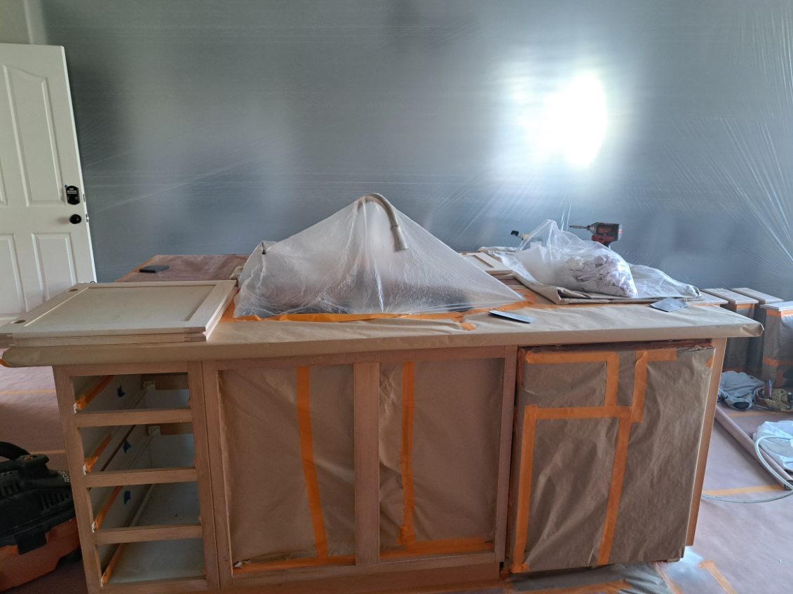 Rainbow Painting Inc. crew protecting furniture and surfaces before painting