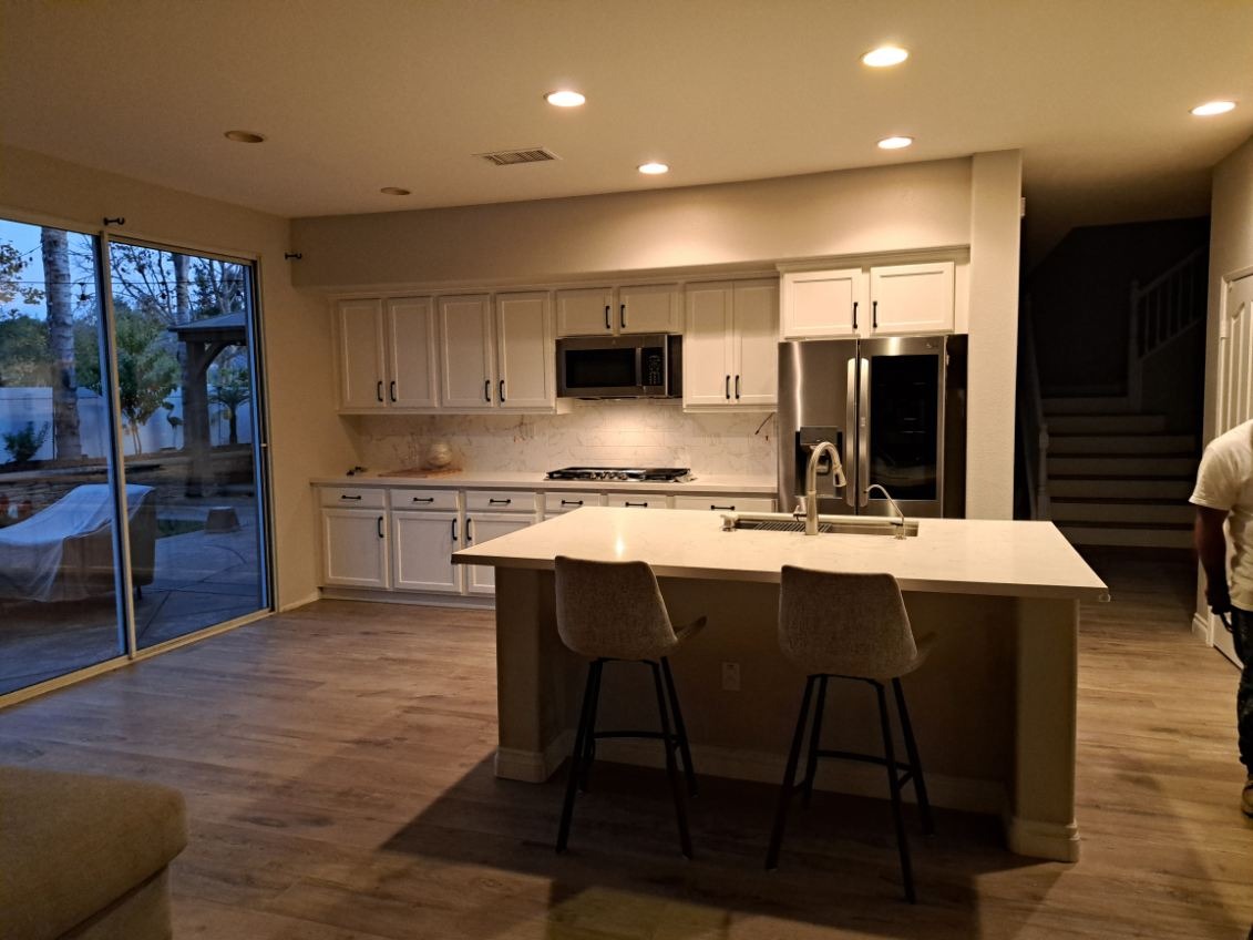Kitchen cabinet transformation by Rainbow Painting Inc.
