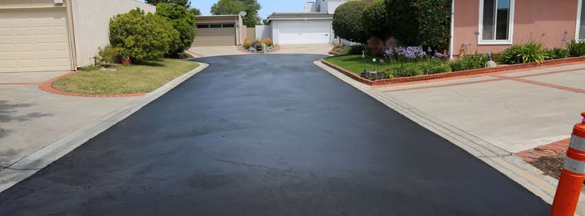 Completed residential asphalt driveway paving project in North Alabama