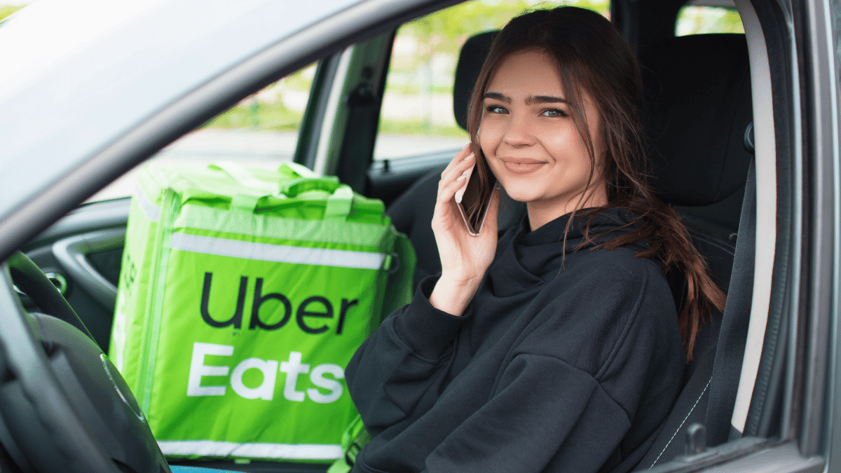 Rideshare driver transporting a passenger in a clean, reliable used sedan