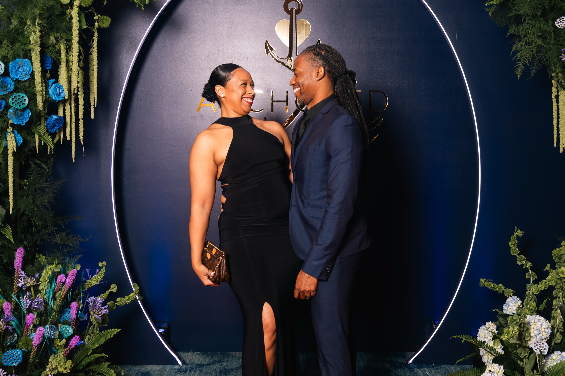 Keston and Jaz smiling at each other at a live event.